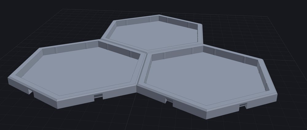 Three 3D-printed hexagonal trays keyed together edge to edge.